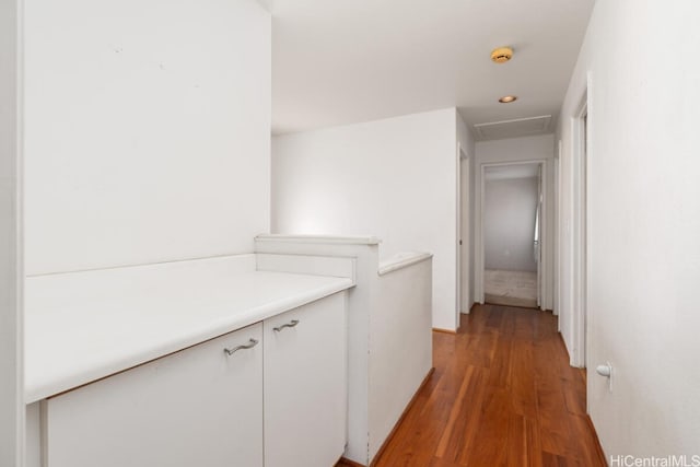 corridor with dark hardwood / wood-style floors