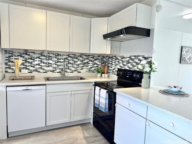 kitchen featuring sink, dishwasher, white cabinetry, backsplash, and electric range