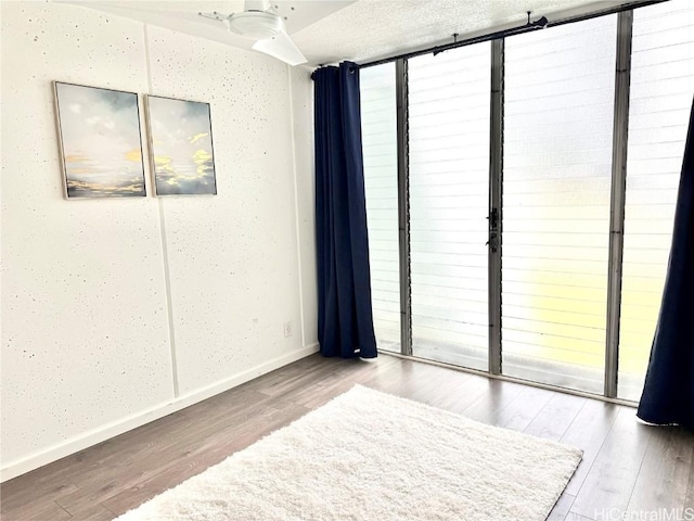 spare room featuring hardwood / wood-style floors