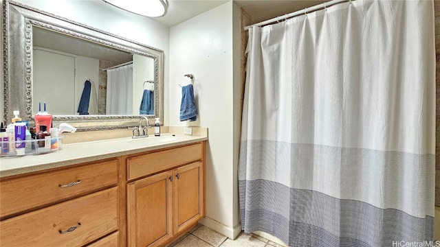 bathroom with tile patterned floors and vanity