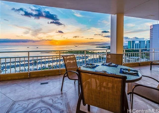 balcony at dusk with a water view