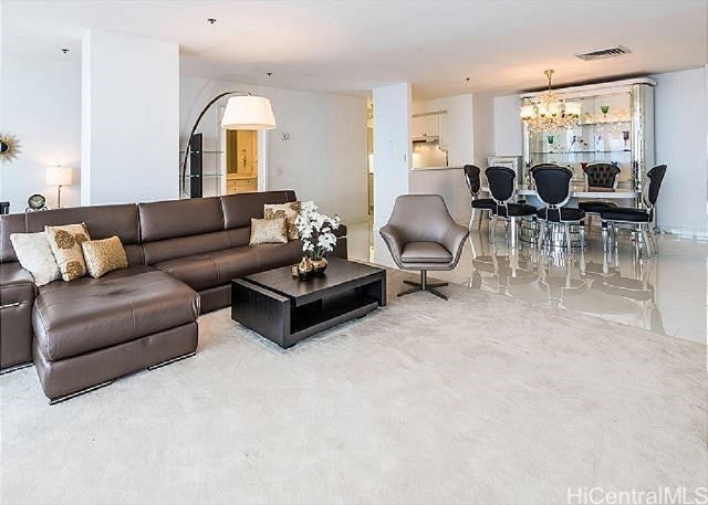 living room with a notable chandelier