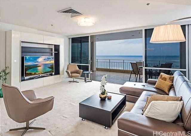 living room featuring floor to ceiling windows