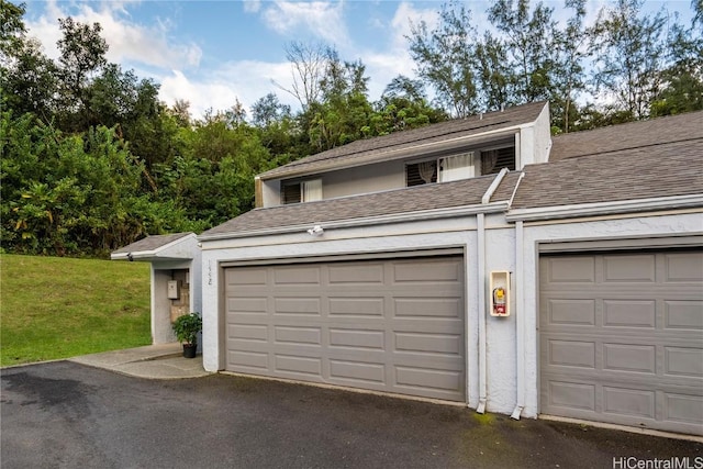 garage featuring a yard