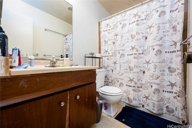 bathroom with toilet and vanity