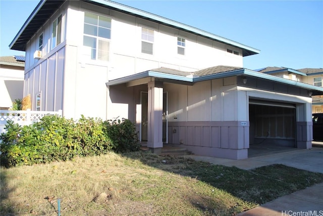 view of side of home with a garage