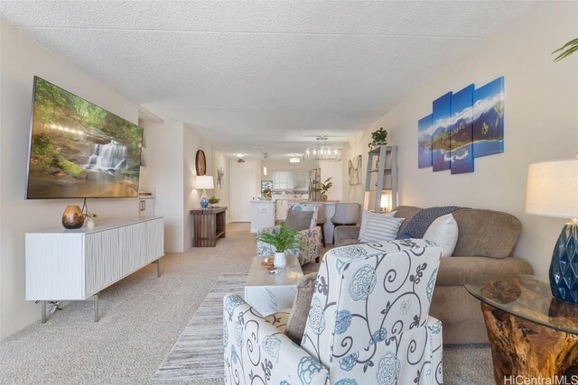 carpeted living room with a textured ceiling