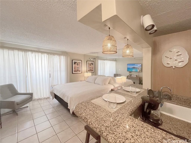 tiled bedroom with a textured ceiling