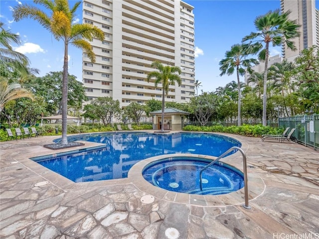 view of pool with a patio area and a community hot tub