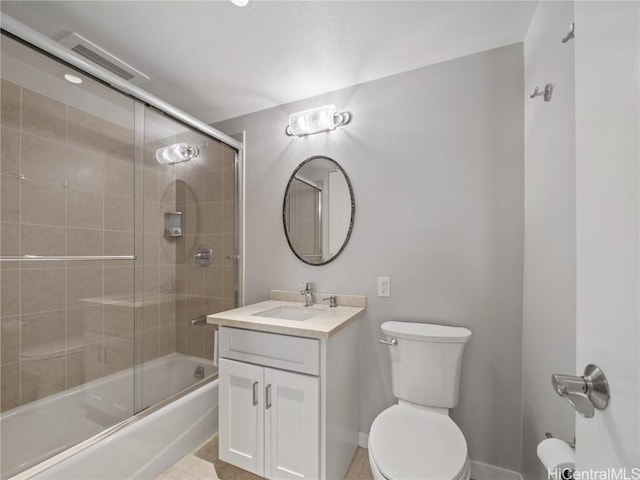 full bathroom with vanity, toilet, enclosed tub / shower combo, and tile patterned floors