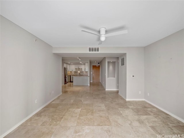 unfurnished living room featuring ceiling fan