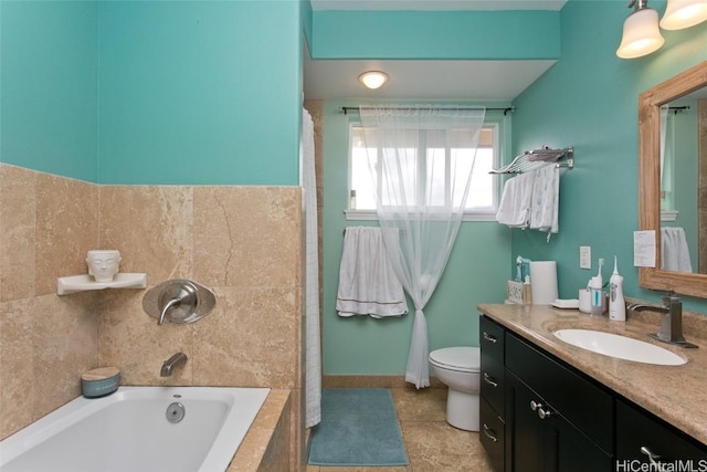 bathroom featuring vanity, tiled tub, tile patterned flooring, and toilet