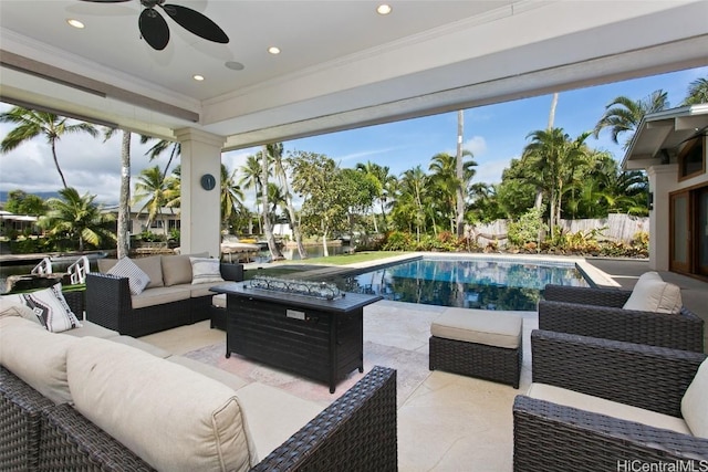 view of swimming pool featuring an outdoor living space, a patio area, and ceiling fan