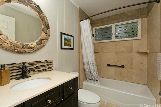 full bathroom with tile patterned flooring, tasteful backsplash, vanity, shower / bath combination with curtain, and toilet