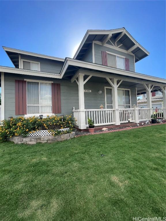 view of front of house featuring a front lawn and a porch