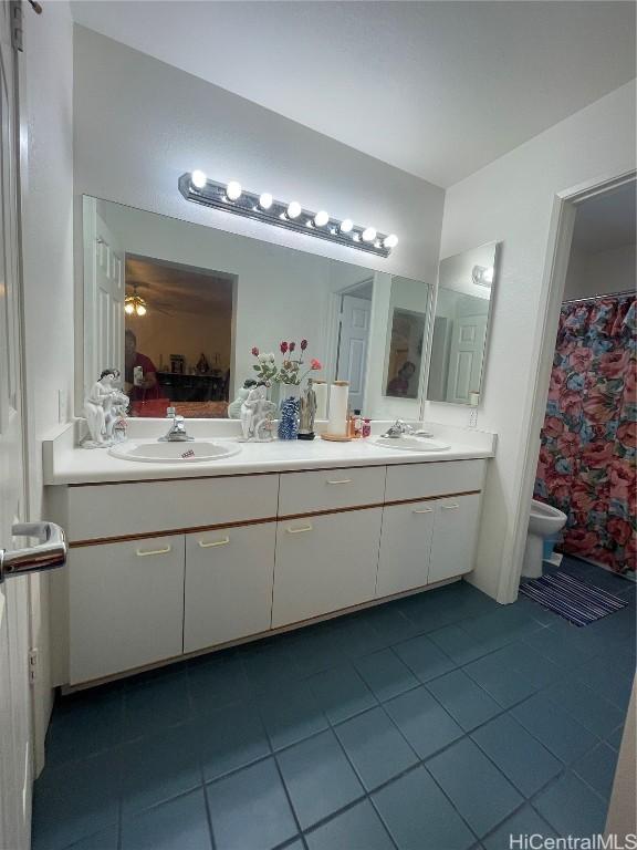 bathroom featuring tile patterned floors and vanity