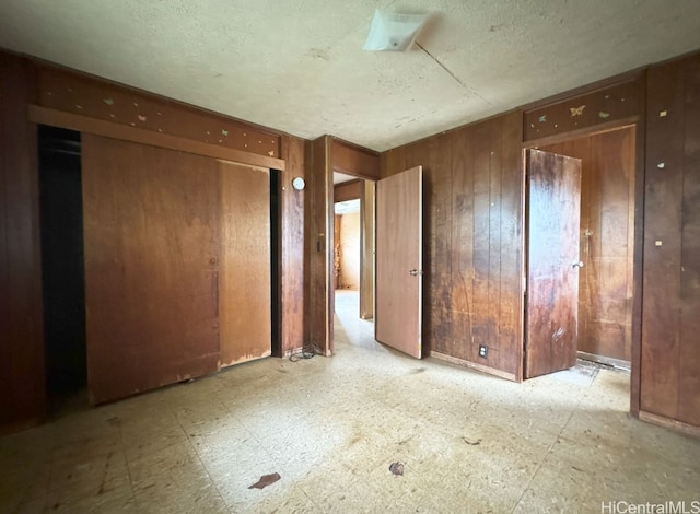 spare room with wooden walls