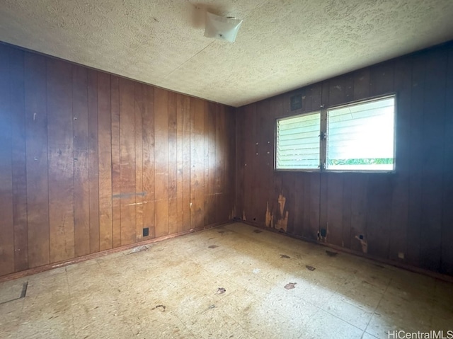 empty room with wood walls