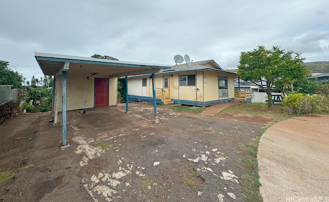 view of front of home with a carport