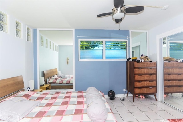 tiled bedroom with ceiling fan