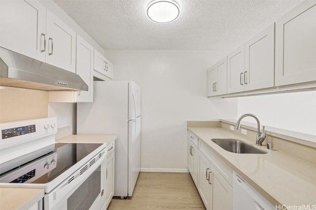 kitchen with white appliances, white cabinets, a textured ceiling, light hardwood / wood-style flooring, and sink