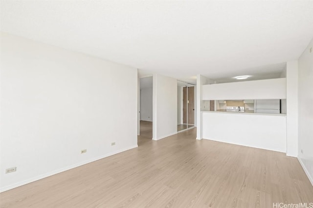 unfurnished living room featuring light wood-type flooring