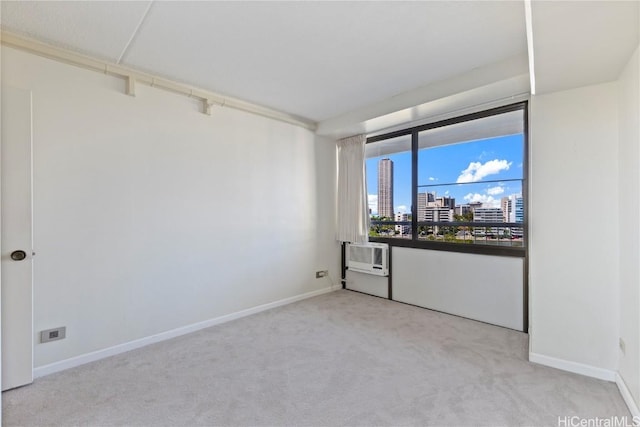 carpeted empty room with a wall mounted AC