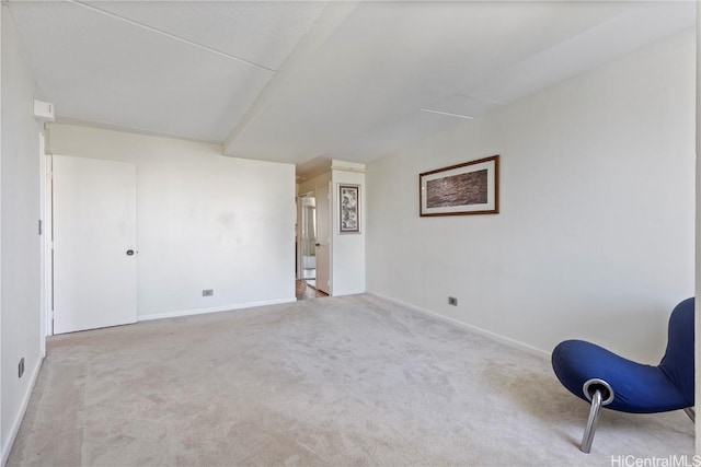 unfurnished room with light colored carpet