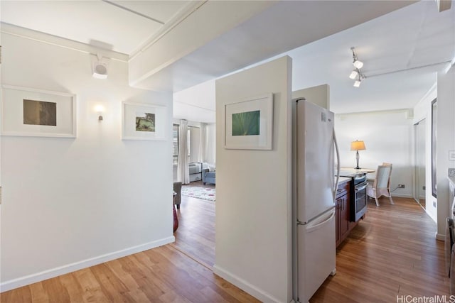 corridor featuring hardwood / wood-style flooring