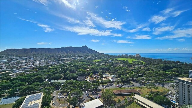 birds eye view of property with a water and mountain view