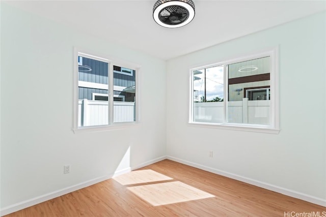 unfurnished room featuring hardwood / wood-style floors