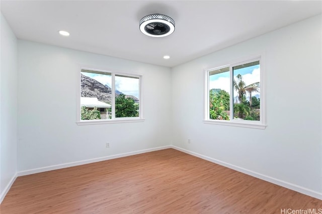 spare room featuring light wood-type flooring