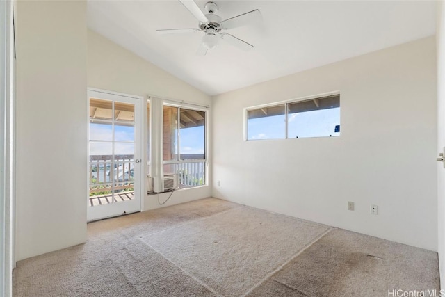 carpeted empty room featuring lofted ceiling, cooling unit, and ceiling fan