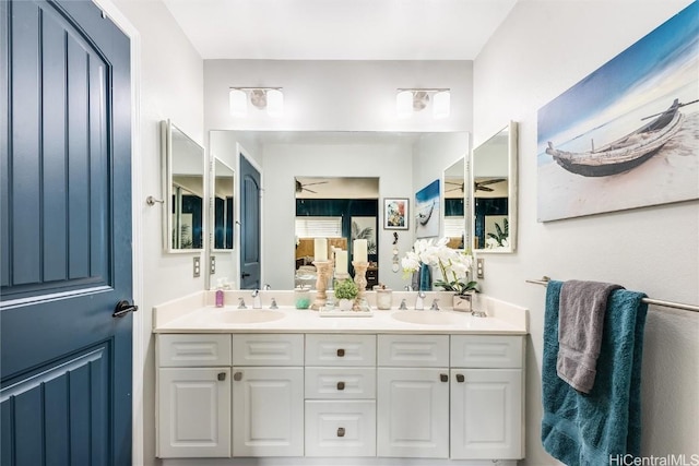 bathroom featuring ceiling fan and vanity