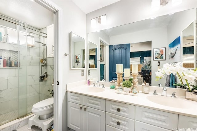 bathroom featuring vanity, toilet, and walk in shower