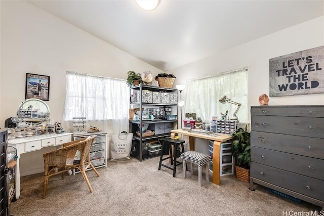 carpeted office featuring lofted ceiling