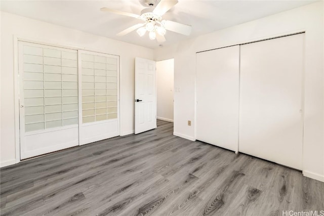 unfurnished bedroom with light hardwood / wood-style floors, a closet, and ceiling fan