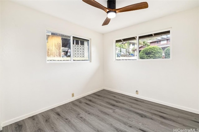 empty room featuring wood-type flooring and ceiling fan