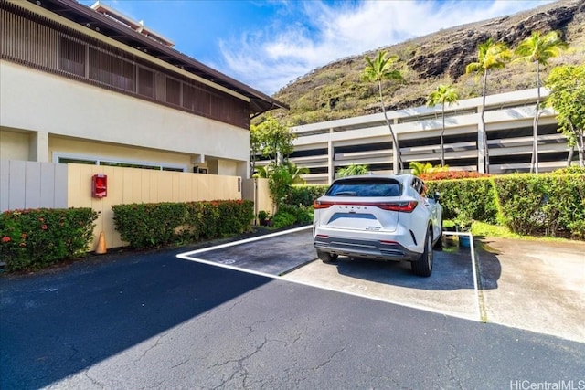 view of vehicle parking with a mountain view