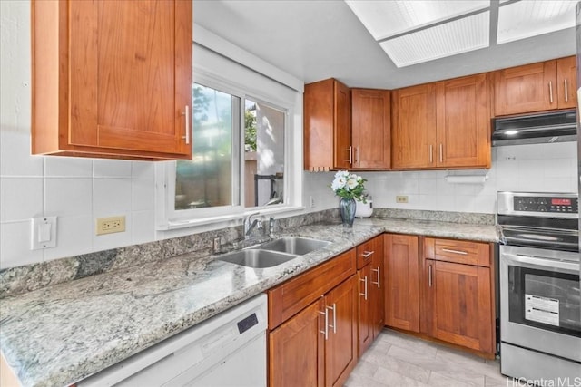 kitchen with white dishwasher, light stone countertops, sink, and stainless steel range with electric cooktop