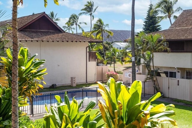 exterior space with a fenced in pool