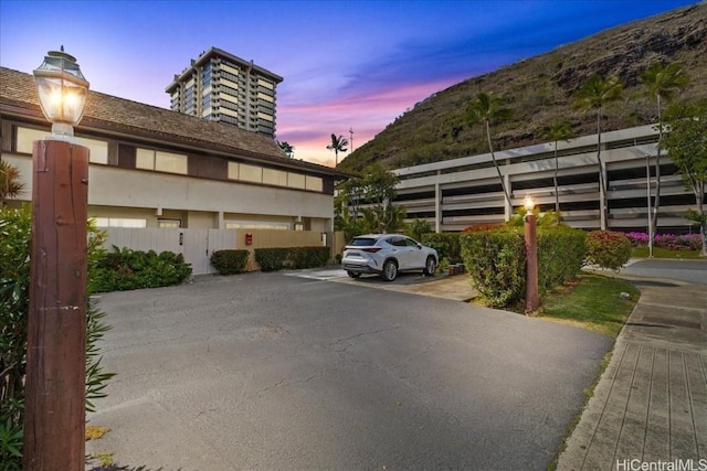 view of parking at dusk