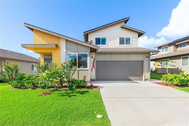 view of front of house featuring a front lawn and a garage