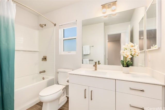 full bathroom with toilet, shower / bath combination with curtain, hardwood / wood-style flooring, and vanity