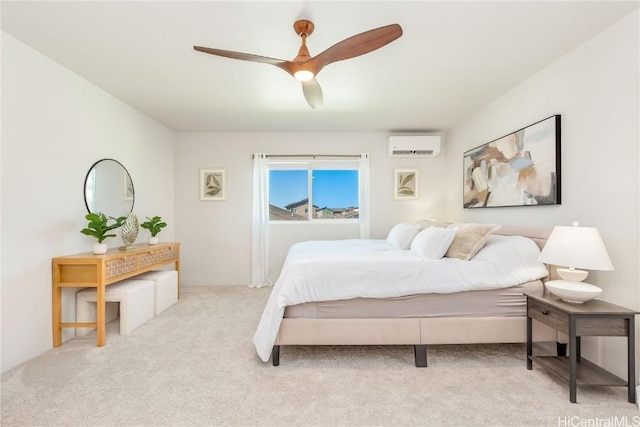 carpeted bedroom featuring ceiling fan and a wall mounted AC