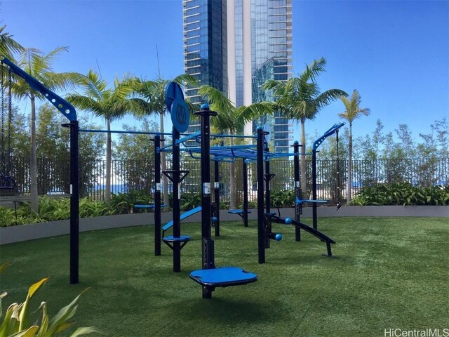 view of jungle gym with a lawn