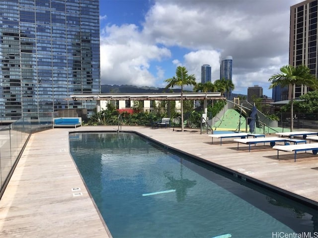 view of swimming pool with a patio