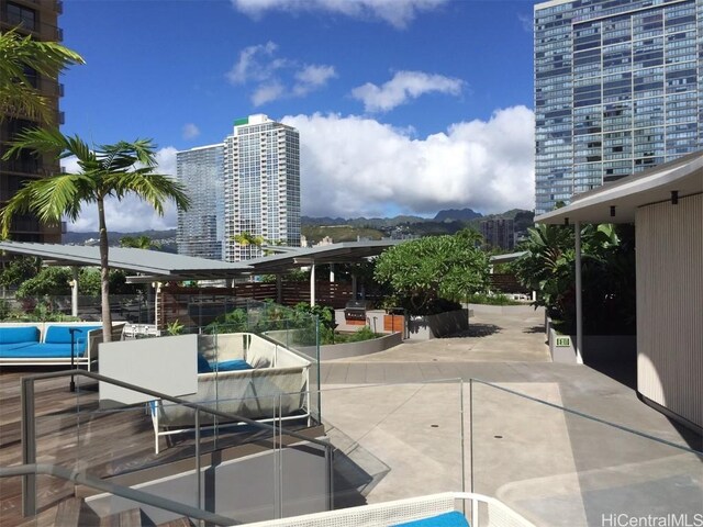 view of patio / terrace featuring a mountain view and an outdoor living space