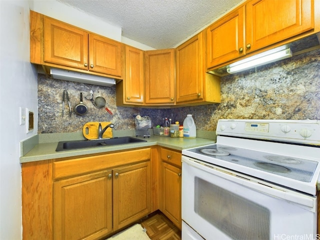 kitchen with a textured ceiling, parquet flooring, white range with electric stovetop, decorative backsplash, and sink