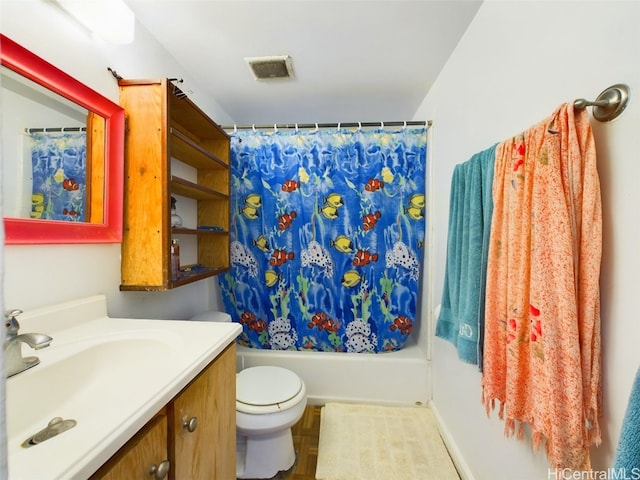 full bathroom featuring toilet, shower / bathtub combination with curtain, and vanity